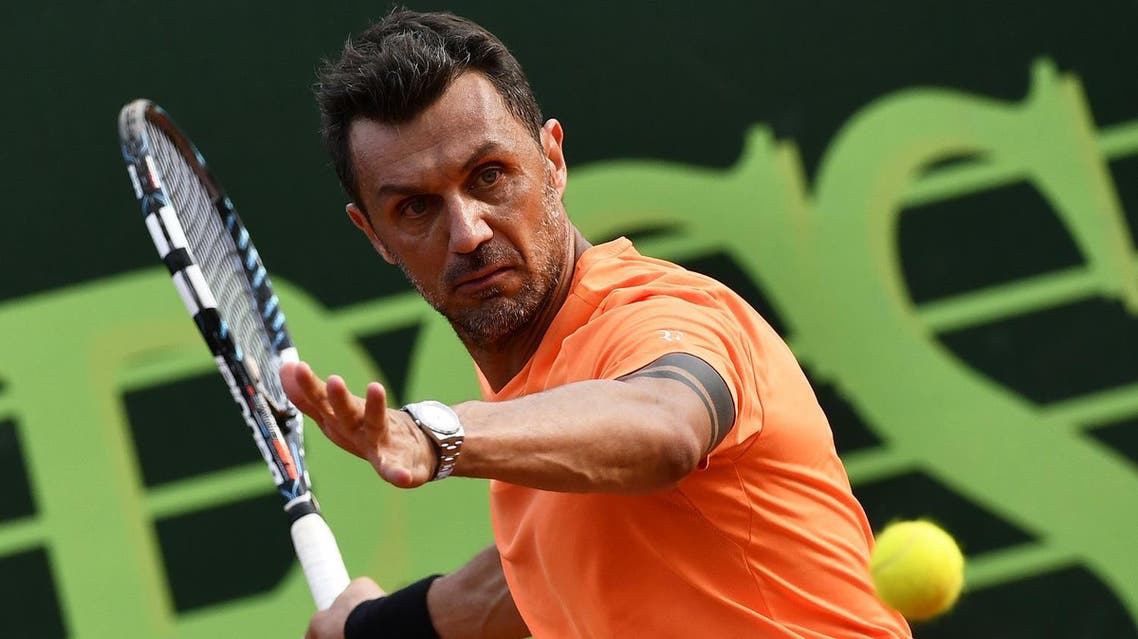 AC Milan's former player Paolo Maldini returns the ball during the men's doubles tennis match, with his partner Stefano Landonio against Poland's player Tomasz Bednarek and Nederland's player David Pel during the ATP Challenger Tour on June 27, 2017 at the Aspria Tennis Club in Milan. AFP