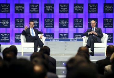 Chinese Premier Li Keqiang (left) and WEF Founder and Executive Chairman Klaus Schwab attend the World Economic Forum in Dalian, China, on June 27, 2017. (Reuters)