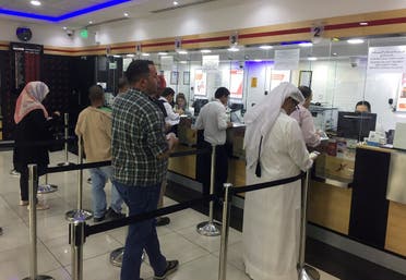 People exchange money at a money exchange office in Doha, Qatar, June 11, 2017. (Reuters)