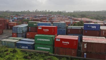 Cargo containers are seen stacked outside the container terminal of Jawaharlal Nehru Port Trust in Mumbai, India. (Reuters)