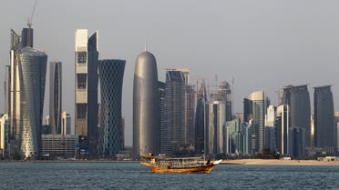 In this Thursday Jan. 6, 2011 file photo, a traditional dhow floats in the Corniche Bay of Doha, Qatar, with tall buildings of the financial district in the background. (AP)