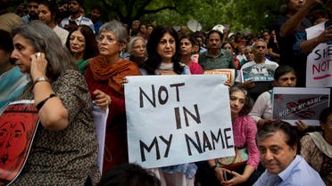 An Indian woman holds placard during a protest against a spate of violent attacks across the country targeting the Muslim minority, in New Delhi on June 28, 2017. (AP)
