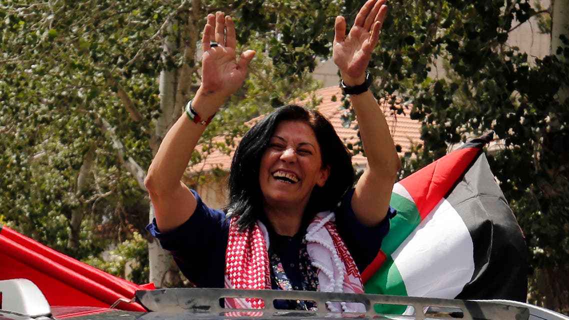 Prominent Palestinian lawmaker Khalida Jarrar (C) greets supporters in her hometown, the West Bank city of Ramallah, following her release from an Israeli jail on June 3, 2016, after serving a 15-month sentence for encouraging attacks against Israelis and violating a travel ban. AFP
