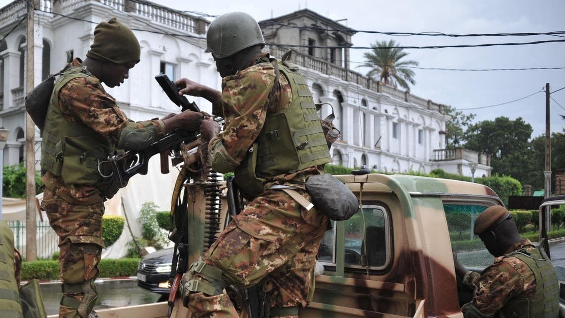 Malian soldiers stand guard in a military vehicle, outside the presidential palace in Bamako, on July 2, 2017, during a G5 Sahel summit. (AFP)