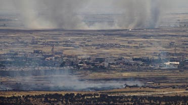 A picture taken from the Israeli-occupied Golan Heights shows smoke billowing from the Syrian side of the border on June 26, 2017. (AFP)