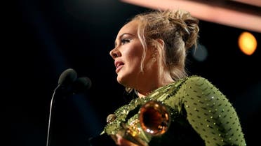 Singer Adele accepts the award for Song of The Year for "Hello" during The 59th GRAMMY Awards at STAPLES Center. (AFP)