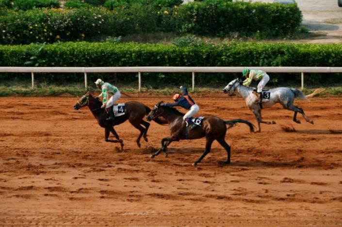 Jockeys compete during a horse race at Beirut Hippodrome, Lebanon, April 30, 2017. (Reuters)