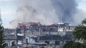 Militants cling on to hundreds of buildings in besieged Philippine city 