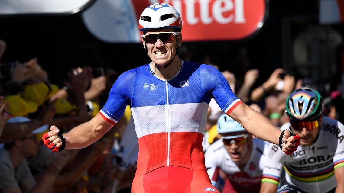 France's Arnaud Demare celebrates as he crosses the finish line ahead of Slovakia's Peter Sagan (R) and Norway's Alexander Kristoff (2ndR) at the end of the 207,5 km fourth stage of the 104th edition of the Tour de France cycling race on July 4, 2017 between Mondorf-les-Bains and Vittel. (AFP)