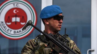 A member of Turkish special force stands guard at the entrance of the courthouse at the Silivri district in Istanbul, on May 29, 2017, during the opening of the 23 army officers suspected of planing last year coup. The trial against 23 army officers suspected of planing last year coup of July 15, 2016, opens on May 29, 2017. (Reuters)
