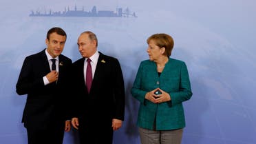 German Chancellor Angela Merkel, Russian President Vladimir Putin and French President Emmanuel Macron meet during the G20 leaders summit in Hamburg, Germany July 8, 2017. (Reuters)