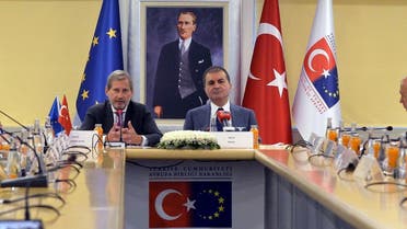 European Commissioner for Enlargement Johannes Hahn (L) and Turkish EU Affairs Minister Omer Celik (R) attend a meeting to discuss Turkey's European Union membership bid on July 6, 2017, in Ankara. (AFP) 