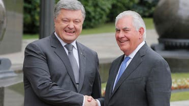 Ukrainian President Petro Poroshenko, left, and U.S. Secretary of State Rex Tillerson shakes hands before a meeting in Kiev, on July 9, 2017.  (AP)