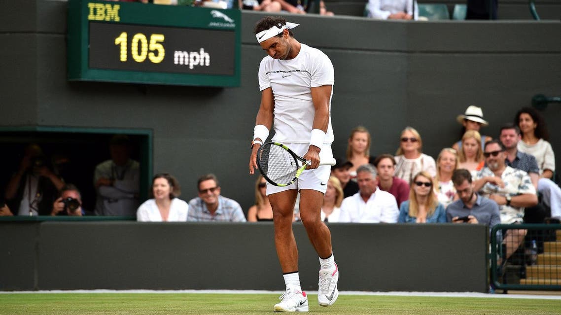 Spain's Rafael Nadal reacts against Luxembourg's Gilles Muller during their men's singles fourth round match on the seventh day of the 2017 Wimbledon Championships at The All England Lawn Tennis Club in Wimbledon, southwest London, on July 10, 2017. (AFP)