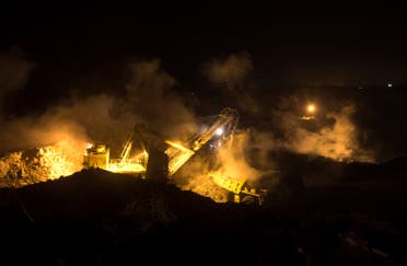 A truck is loaded with top soil at the Jharia burning coal field at Dhanbad district in the eastern state of Jharkhand, India, September 17, 2012. (Reuters)
