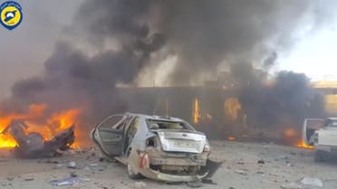 A still image taken from a video uploaded by White Helmets on June 24, 2017, shows vehicles on fire at the site of a car bomb, said to be in the town of al-Dana, in Syria's rebel-held Idlib province. reuters