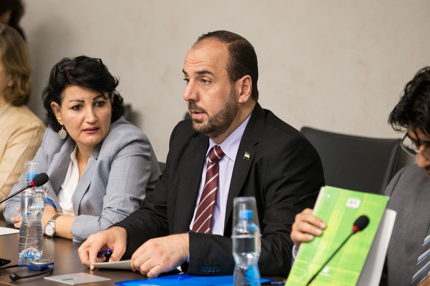 Syria's main opposition High Negotiations Committee (HNC) leader Nasr al-Hariri (C) attends a new round of negotiation with UN Special Envoy of the Secretary-General for Syria Staffan de Mistura. (Reuters)