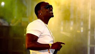 Rapper Akon to buy 50% of African music download service 