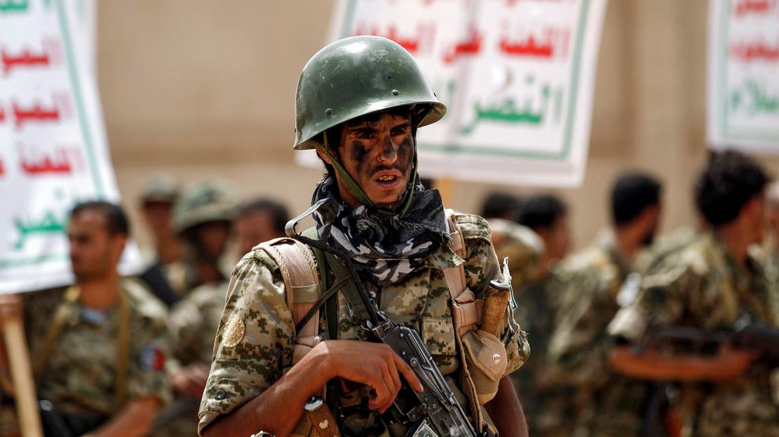 A newly-recruited Houthi fighter poses with a Kalashnikov assault rifle in Sanaa on July 16, 2017. (AFP)