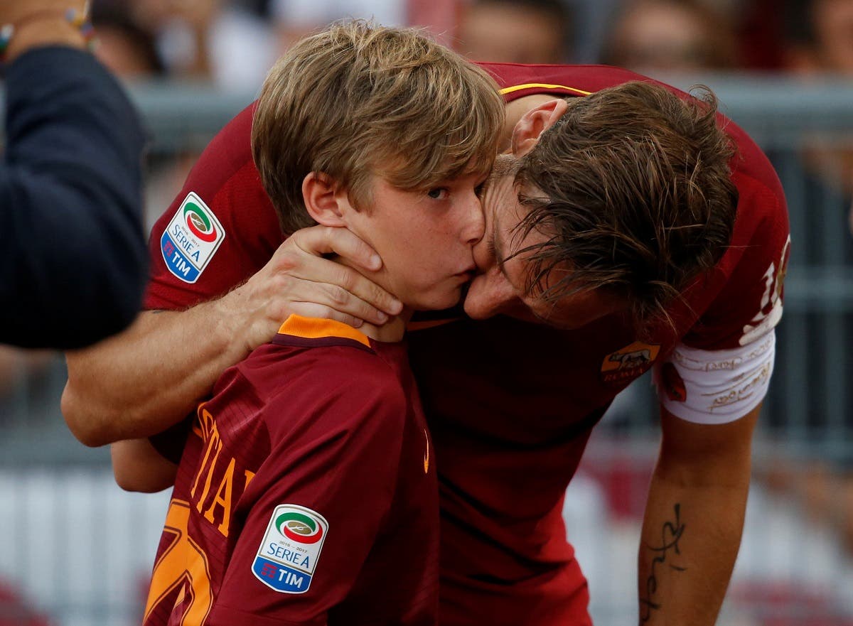 Roma’s Francesco Totti with his son Cristian after his last game (Reuters)