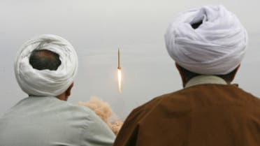 Iranian clergymen watch a Shahab-3 long-range ballistic missile fird by Iran's Revolutionary Guards in the desert outside the holy city of Qom. (File photo: AFP)
