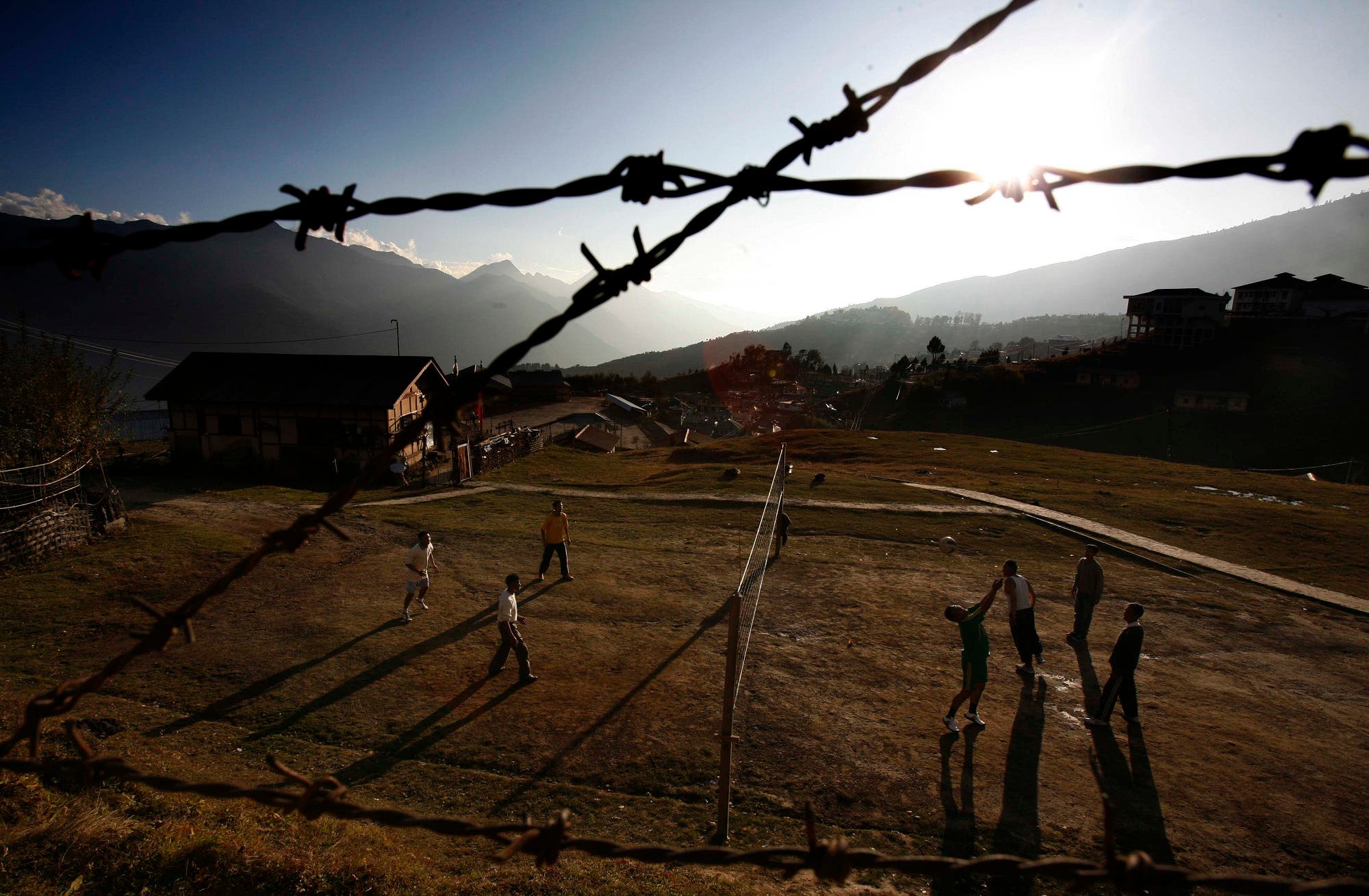 Policemen play volleyball in Tawang, in the northeastern Indian state of Arunachal Pradesh, Nov. 5, 2009. The Indian government refused Thursday to allow foreign journalists to cover the visit of the Tibetan spiritual leader Dalai Lama to the northeastern state at the heart of a long-running border dispute with China. (AP)
