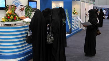 Saudi Arabian women, seeking a job, talk with recruiters during a job fair in Riyadh January 25, 2012. (Reuters)