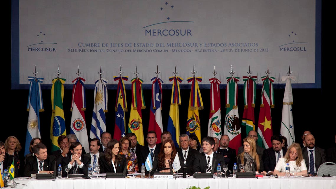 Argentina's President Cristina Fernandez, center, delivers a speech at the Mercosur summit in Mendoza, Argentina, Friday, June 29, 2012.ap