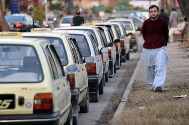 A Pakistani driver waits for customers at a taxi stand outside a supermarket in Islamabad on January 31, 2009. (AFP)