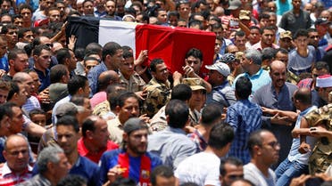 Relatives and friends carry the coffin of the officer Khaled al-Maghrabi, who was killed during a suicide bomb attack on an army checkpoint in Sinai, during his funeral in his hometown Toukh, Al Qalyubia Governorate, north of Cairo, on July 8, 2017. (Reuters)
