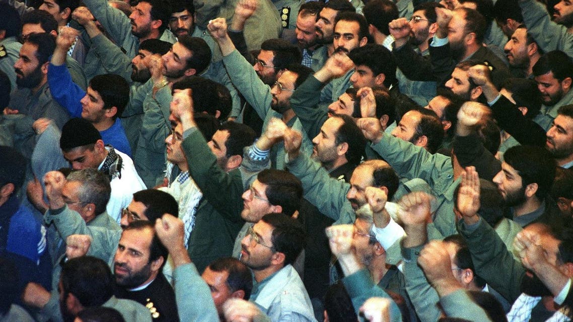 Members of the IRGC cheer during the speech of Iran’s Supreme Leader Ayatollah Ali Khamenei on the occasion of IRGC Week in Tehran 13 November 1999. (AFP)