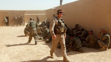 A US Marine (C) walks as Afghan National Army (ANA) soldiers attend a training exercise in Helmand province, Afghanistan July 5, 2017. (Reuters)