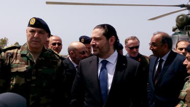 Saad al-Hariri arrives with Army Commander General Joseph Aoun (L) at the United Nations Interim Force in Lebanon (UNIFIL) headquarters in Naqoura, southern Lebanon April 21, 2017. (Reuters)
