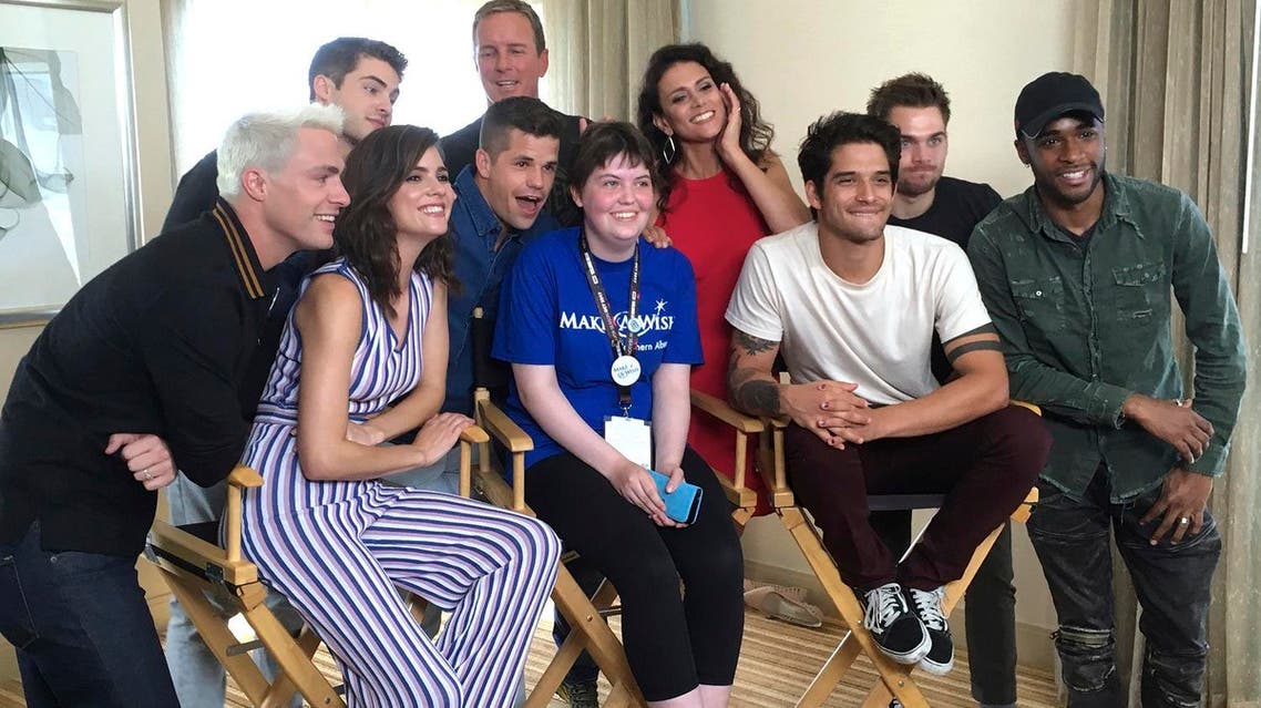 Sydney Lang, 16, of Edmonton, Alberta, seated center, poses with cast members from "Teen Wolf" during a meet-and-greet arranged by the Make-A-Wish Foundation on Friday, July 21, 2017, in San Diego. (AP)