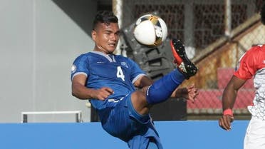 El Salvador's Henry Romero, left, controls the ball as Belize's Michael Salazar looks on during a Central America Cup soccer match in Panama City, Tuesday, Jan. 17, 2017. (AP)