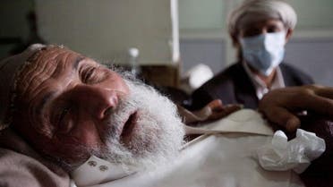 An old man infected with cholera lies on the bed at a hospital in Sanaa. (File photo: Reuters)