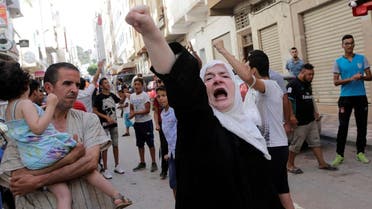 A women shouts slogan during a demonstration against official abuses and corruption in the town of Al-Hoceima. (Reuters)