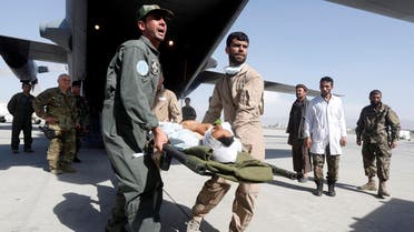 Afghan Air Force medical personnel carry an injured member of the Afghan security forces off a C-130 military transport plane in Kabul, Afghanistan July 9, 2017. (Reuters)