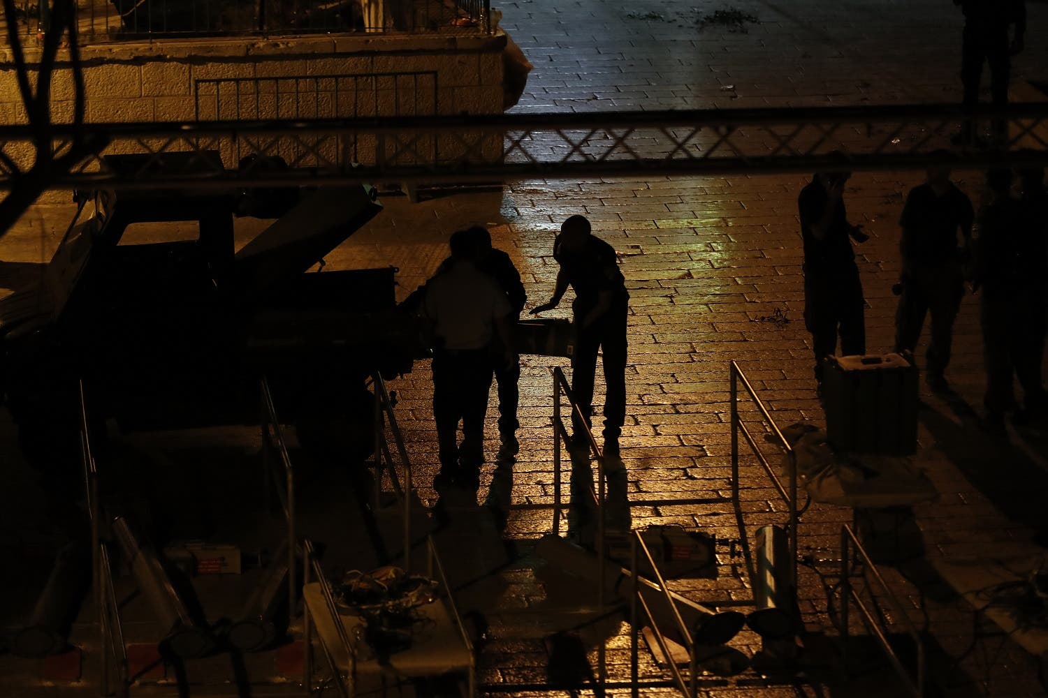 Israeli security forces take down security barriers at the Lions’ Gate on July 24, 2017. (AFP)