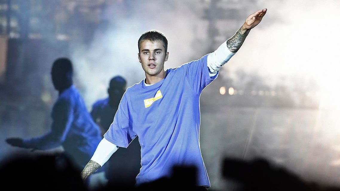 (FILES) This file photo taken on September 20, 2016 shows Canadian singer Justin Bieber performing on stage at the AccorHotels Arena in Paris. Bieber is not welcome to perform in China because of his "bad beahviour", Beijing authorities have said, after the pop idol angered many Chinese in 2014 by visiting a controversial Japanese war shrine. AFP