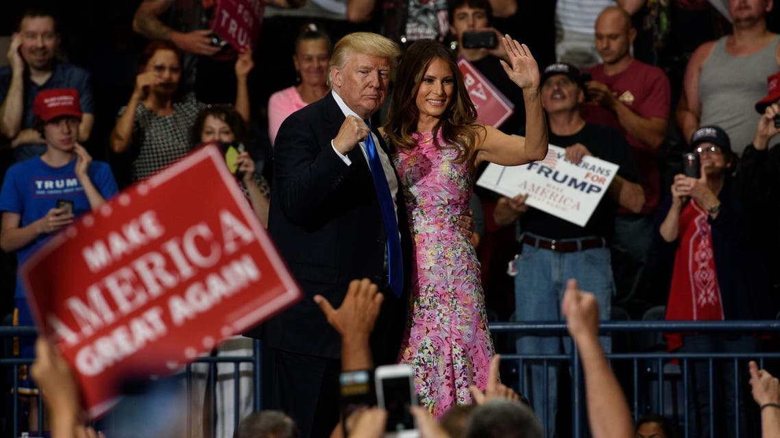 President Trump and Melania Trump walk off the stage after a rally at the Covelli Centre on July 25, 2017 in Youngstown, Ohio. (AFP)