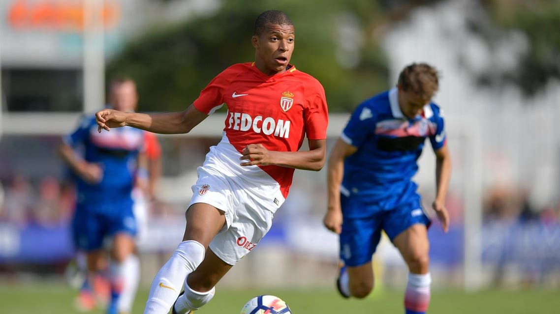 (FILES) This file photo taken on July 15, 2017 shows Monaco's forward Kylian Mbappe controling the balll during a friendly football match between AS Monaco and Stoke City FC in Martigny. Real Madrid have reportedly reached a world record deal in principle to sign Kylian Mbappe from Monaco for 180 million euros ($210m, £160m), closing one of the hottest transfer sagas of the summer. Spanish sports daily Marca, citing sources close to the negotiations, said the gifted teenage striker who shot to stardom last season is expected to join Real "in the next few days" on a six year deal.