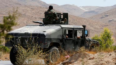 Lebanese army soldiers are seen inside a military vehicle in Labwe, at the entrance of the border town of Arsal, in eastern Bekaa Valley, Lebanon July 24, 2017