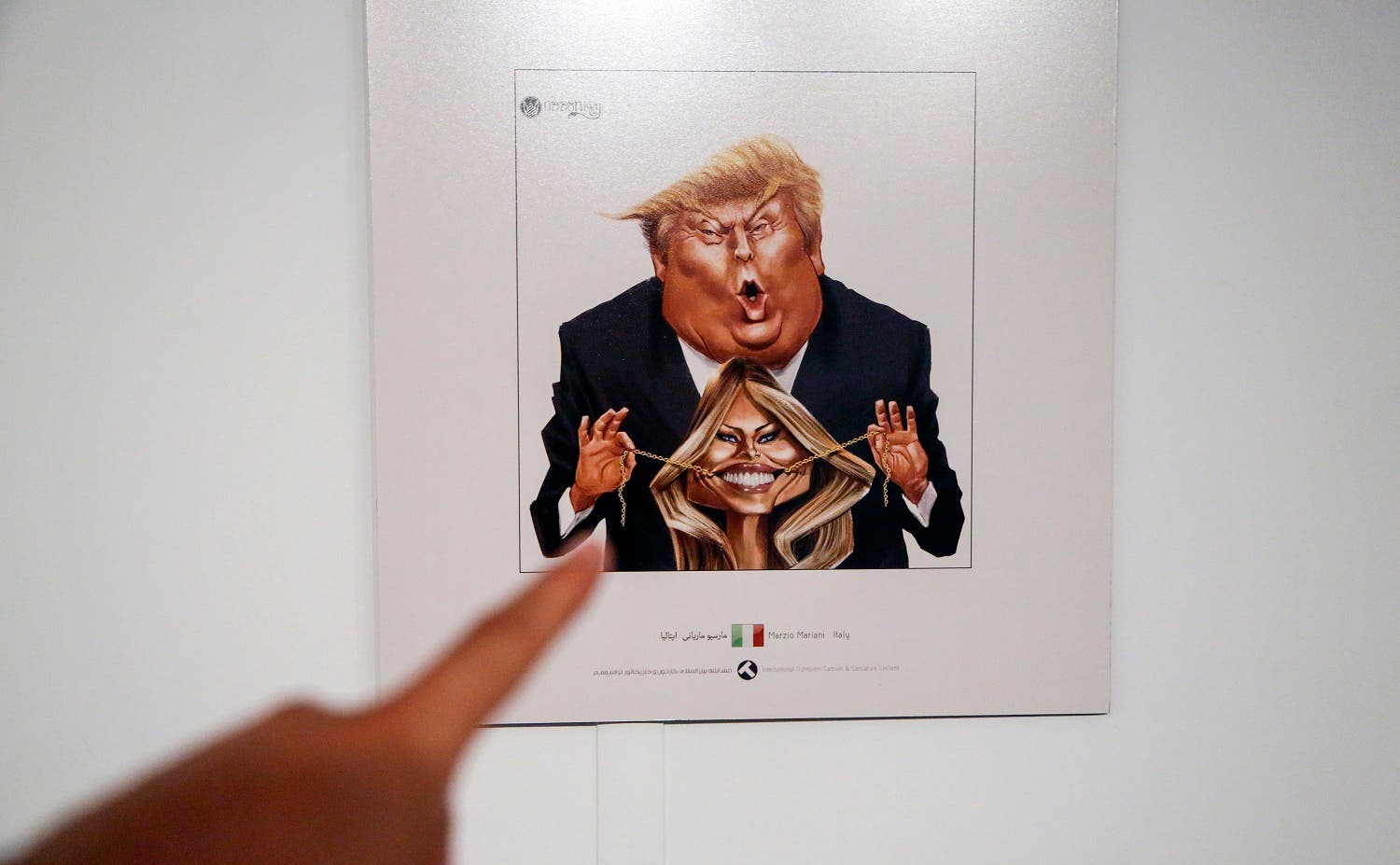 A picture taken on July 3, 2017 shows a cartoon of President Trump and Melania Trump on display at an exhibition of Iran’s 2017 International Trumpism cartoon and caricature contest, in the capital Tehran. (AFP)