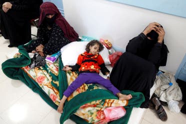 A girl infected with cholera lies on the ground at a hospital in Sanaa. REUTERS/Khaled Abdullah