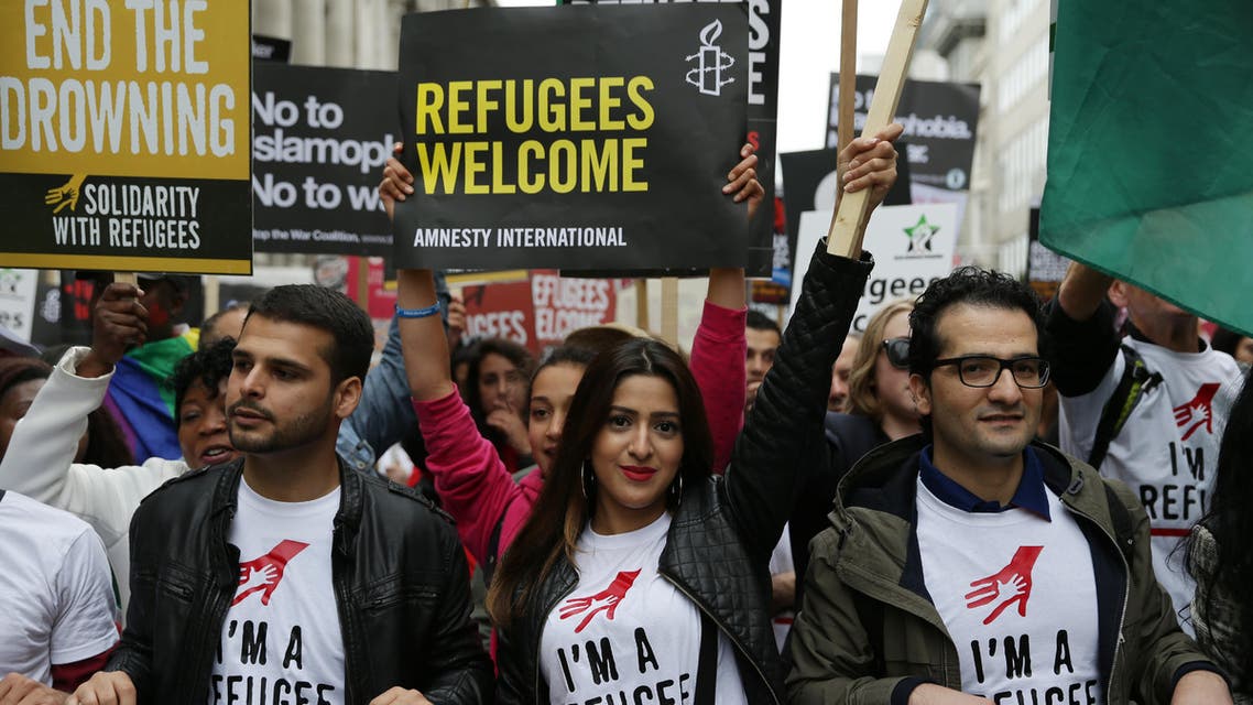 Demonstrators take part in a march calling for the British parliament to welcome refugees in the UK in central London on September 17, 2016. Thousands marched in central London calling on the British government to do more to help refugees fleeing conflict and persecution.