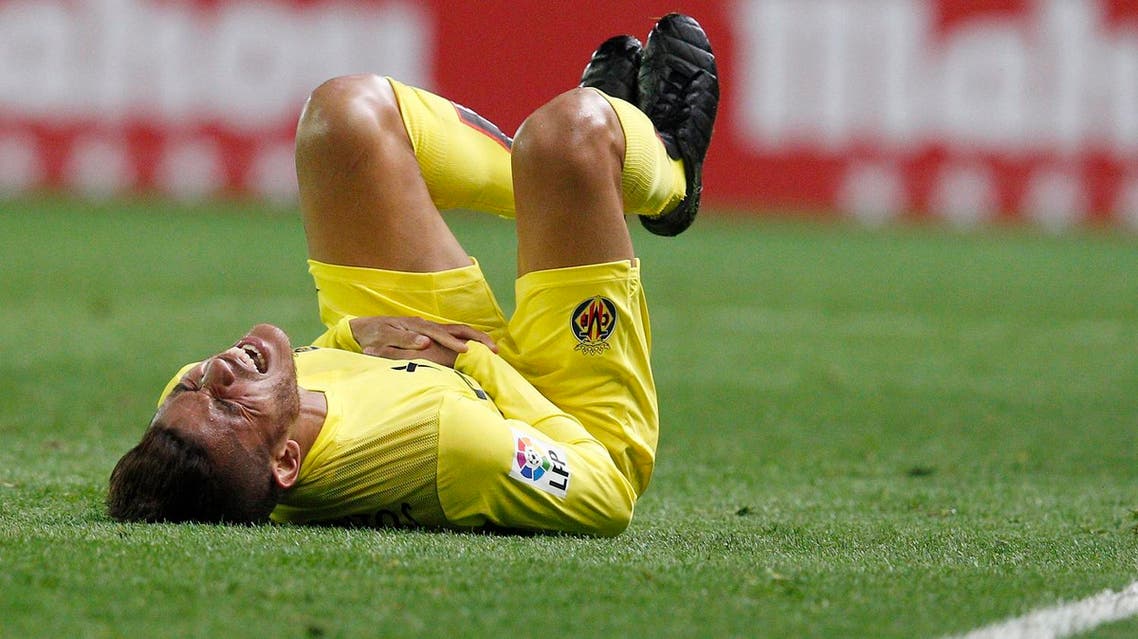 Jonathan dos Santos gestures as he lies on the field during the Spanish league football match Villarreal CF vs Malaga CF on February 13, 2016. (AFP)