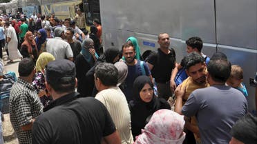 This photo released Tuesday, July 11, 2017 by the Syrian official news agency SANA, shows Syrians arriving from Jarablus, in Aleppo province, to their old neighborhood of al-Waer, in Homs, Syria. (AP)