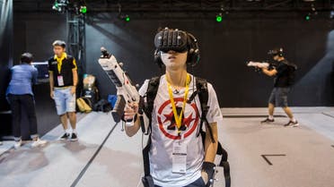 A gamer tries a virtual reality (VR) game as comic book and gaming fans attend the annual Ani-Com and Games Fair in Hong Kong on July 28, 2017. (AFP)
