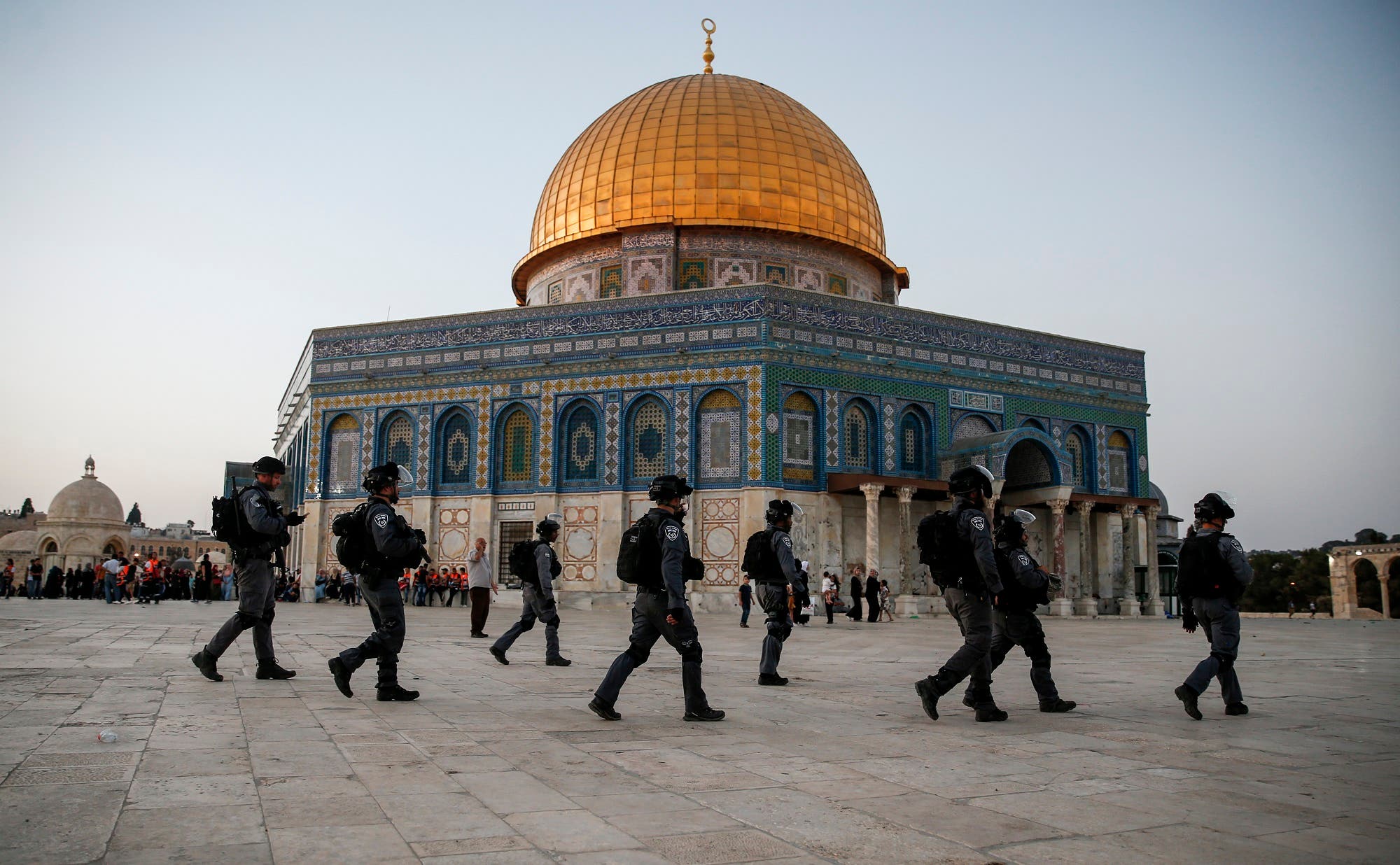 Members of the Israeli security forces walk past the al-Aqsa compound in the Old City of Jerusalem on July 27, 2017. (AFP)